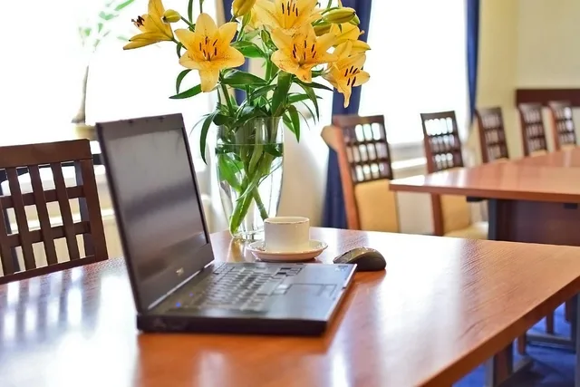 conference room, notebook, meeting room, laptop, meeting, fresh flowers, presentation table, yellow flowers, notebook and coffee break from the meeting, lifestyle, business services, conference services, lecture. Seven checks for commercial teams choosing loyalty software